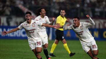 Universitario's midfielder Piero Quispe (L) celebrates after scoring during the Copa Sudamericana group stage second leg football match between Peru's Universitario and Argentina's Gimnasia y Esgrima La Plata at the Monumental stadium in Lima on June 28, 2023. (Photo by CRIS BOURONCLE / AFP)