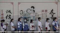 BEIJING, CHINA - JULY 07: Chinese students wait with social distancing protocols to enter a school to take the National College Entrance Examination, also known as Gaokao, at a high school on July 7, 2020 in Beijing, China. The important exams were delayed for a month due to restrictions related to the coronavirus pandemic. (Photo by Kevin Frayer/Getty Images)