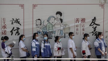 BEIJING, CHINA - JULY 07: Chinese students wait with social distancing protocols to enter a school to take the National College Entrance Examination, also known as Gaokao, at a high school on July 7, 2020 in Beijing, China. The important exams were delayed for a month due to restrictions related to the coronavirus pandemic. (Photo by Kevin Frayer/Getty Images)