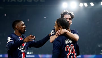 Soccer Football - Champions League - Knockout Phase Playoff - Second Leg - Paris St Germain v Brest - Parc des Princes, Paris, France - February 19, 2025 Paris St Germain's Bradley Barcola celebrates scoring their first goal with Vitinha and Ousmane Dembele REUTERS/Christian Hartmann
