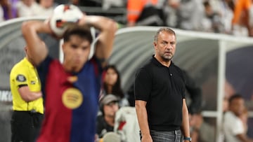Barcelona's head coach Hansi Flick looks on during the pre-season club friendly football match between Real Madrid and Barcelona at MetLife Stadium in East Rutherford, New Jersey, August 3, 2024. (Photo by Charly TRIBALLEAU / AFP)