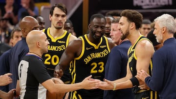 Klay Thompson #11 and Draymond Green #23 of the Golden State Warriors complain to the referee after getting into an altercation with the Minnesota Timberwolves at Chase Center on November 14, 2023 in San Francisco, California.