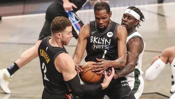 Jun 7, 2021; Brooklyn, New York, USA; Brooklyn Nets forwards Kevin Durant (7) and Blake Griffin (2) and Milwaukee Bucks guard Jrue Holiday (21) try to grab a loose ball in the first quarter during game two in the second round of the 2021 NBA Playoffs. at Barclays Center. Mandatory Credit: Wendell Cruz-USA TODAY Sports