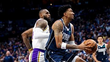 Dallas Mavericks forward Christian Wood (35) drives to the basket past Los Angeles Lakers forward LeBron James (6) during the second quarter at American Airlines Center.