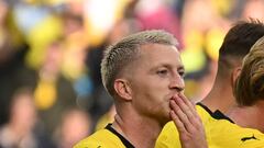 (FILES) Dortmund's German forward #11 Marco Reus celebrates sending a kiss after scoring the 1-0 goal during the German first division Bundesliga football match between Borussia Dortmund and VfL Wolfsburg in Dortmund, western Germany, on September 23, 2023. Borussia Dortmund veteran Marco Reus will leave after 12 years with the side at the end of the season, the club announced on May 3, 2024. Both parties agreed Reus' contract would not be extended, although the 34-year-old wants to keep playing and will not retire. (Photo by INA FASSBENDER / AFP) / DFL REGULATIONS PROHIBIT ANY USE OF PHOTOGRAPHS AS IMAGE SEQUENCES AND/OR QUASI-VIDEO