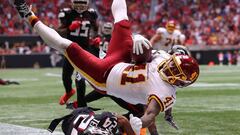 ATLANTA, GEORGIA - OCTOBER 03: J.D. McKissic #41 of the Washington Football Team dives for the go-ahead touchdown against A.J. Terrell #24 and Duron Harmon #21 of the Atlanta Falcons in the fourth quarter at Mercedes-Benz Stadium on October 03, 2021 in At