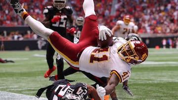 ATLANTA, GEORGIA - OCTOBER 03: J.D. McKissic #41 of the Washington Football Team dives for the go-ahead touchdown against A.J. Terrell #24 and Duron Harmon #21 of the Atlanta Falcons in the fourth quarter at Mercedes-Benz Stadium on October 03, 2021 in At