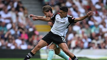 Brentford's Danish midfielder #08 Mathias Jensen challenges Fulham's Mexican striker #07 Raul Jimenez (front) during the English Premier League football match between Fulham and Brentford at Craven Cottage in London on August 19, 2023. (Photo by JUSTIN TALLIS / AFP) / RESTRICTED TO EDITORIAL USE. No use with unauthorized audio, video, data, fixture lists, club/league logos or 'live' services. Online in-match use limited to 120 images. An additional 40 images may be used in extra time. No video emulation. Social media in-match use limited to 120 images. An additional 40 images may be used in extra time. No use in betting publications, games or single club/league/player publications. /