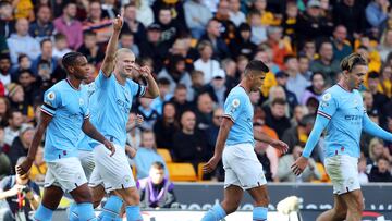 Manchester City's Norwegian striker Erling Haaland (2L) celebrates scoring his team's second goal during the English Premier League football match between Wolverhampton Wanderers and Manchester City at the Molineux stadium in Wolverhampton, central England on September 17, 2022. (Photo by Geoff Caddick / AFP) / RESTRICTED TO EDITORIAL USE. No use with unauthorized audio, video, data, fixture lists, club/league logos or 'live' services. Online in-match use limited to 120 images. An additional 40 images may be used in extra time. No video emulation. Social media in-match use limited to 120 images. An additional 40 images may be used in extra time. No use in betting publications, games or single club/league/player publications. /