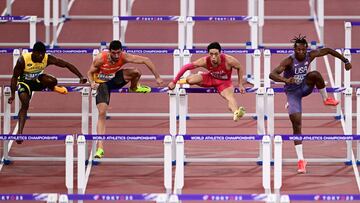 (L-R) Jamaica's Orlando Bennett, Spain's Enrique Llopis, China's Liu Junxi and US' Dylan Beard compete in the men's 110m hurdles semi-final during the World Athletics Championships in Tokyo on September 16, 2025. (Photo by Yuichi YAMAZAKI / AFP)