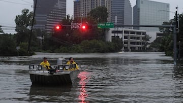 Rescue crews search for people in distress after Hurricane Harvey caused heavy flooding in Houston, Texas on August 27, 2017. 
 Massive flooding unleashed by deadly monster storm Harvey left Houston -- the fourth-largest city in the United States -- increasingly isolated as its airports and highways shut down and residents fled homes waist-deep in water. / AFP PHOTO / MARK RALSTON