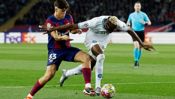 Soccer Football - Champions League - Round of 16 - Second Leg - FC Barcelona v Napoli - Estadi Olimpic Lluis Companys, Barcelona, Spain - March 12, 2024 FC Barcelona's Pau Cubarsi in action with Napoli's Victor Osimhen REUTERS/Albert Gea