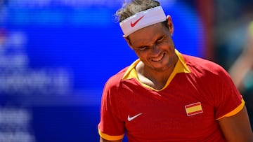 Spain's Rafael Nadal reacts while playing Serbia's Novak Djokovic during their men's singles second round tennis match on Court Philippe-Chatrier at the Roland-Garros Stadium at the Paris 2024 Olympic Games, in Paris on July 29, 2024. (Photo by Martin BERNETTI / AFP)