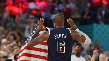 Lebron James of United States celebrates with flag after United States win gold.