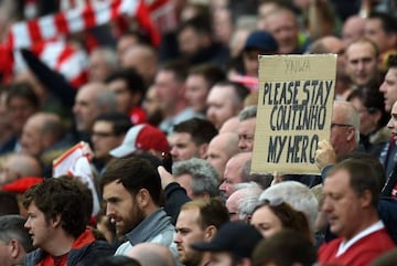 A fan holds up a placard in support of Liverpool's Brazilian midfielder Philippe Coutinho.