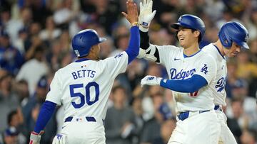 Jun 11, 2024; Los Angeles, California, USA; Los Angeles Dodgers designated hitter Shohei Ohtani (17) celebrates at home plate with shortstop Mookie Betts (50) after hitting a two-run home run in the sixth inning against the Texas Rangers at Dodger Stadium. at Dodger Stadium. Mandatory Credit: Kirby Lee-USA TODAY Sports
