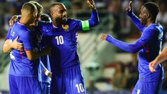 French forward #10 ALexandre LAcazette (C) celebrates with his teammates after scoring his team's fifth goal during the U23 friendly football match between France and Dominican Republic at Mayol Stadium in Toulon, south-eastern France, on July 11, 2024, in preparation for the Paris 2024 Olympic Games. (Photo by CLEMENT MAHOUDEAU / AFP)