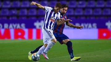 VALLADOLID, SPAIN - JULY 01: Pablo Hervias of Real Valladolid CF competes for the ball with &#039;To&ntilde;o&#039; Garcia of Levante UD during the Liga match between Real Valladolid CF and Levante UD at Jose Zorrilla on July 01, 2020 in Valladolid, Spain