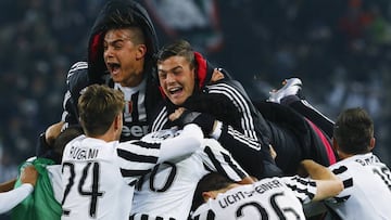 Simone Zaza is mobbed by teammates after scoring the winner. 