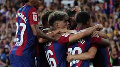 Barcelona's players celebrate their team's first goal during the Spanish Liga football match between FC Barcelona and Cadiz CF at the Lluis Companys Olimpic Stadium in Barcelona on August 20, 2023. (Photo by LLUIS GENE / AFP)