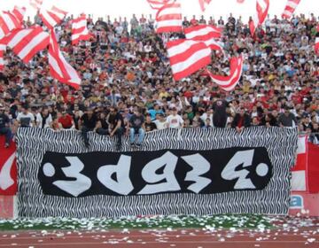 Red Star Belgrade fans display stolen Partizan banner