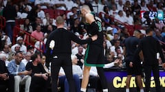 MIAMI, FLORIDA - APRIL 29: Kristaps Porzingis #8 of the Boston Celtics leaves the game against the Miami Heat during the second quarter after suffering an apparent injury in game four of the Eastern Conference First Round Playoffs at Kaseya Center on April 29, 2024 in Miami, Florida. NOTE TO USER: User expressly acknowledges and agrees that, by downloading and or using this photograph, User is consenting to the terms and conditions of the Getty Images License Agreement.   Megan Briggs/Getty Images/AFP (Photo by Megan Briggs / GETTY IMAGES NORTH AMERICA / Getty Images via AFP)