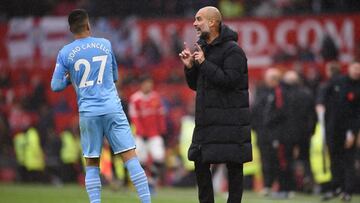 Cancelo y Guardiola.