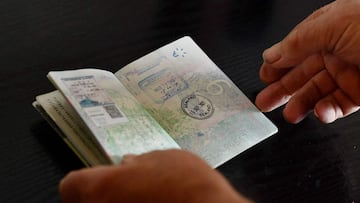 Chief Engineer and Head of Homeland Security, Michael Barington stamps the passport of a visitor to the Principality of Sealand, some seven miles (11 kilometres) off the coast of southeast England, on September 16, 2021.