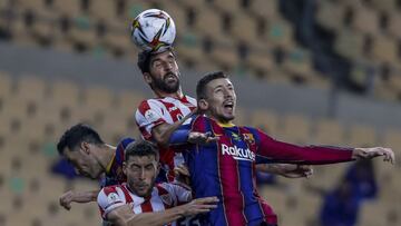 Athletic Bilbao&#039;s Raul Garcia, top, heads the ball next to Barcelona&#039;s Clement Lenglet, right, during the Spanish Supercopa final soccer match between FC Barcelona and Athletic Bilbao at La Cartuja stadium in Seville, Spain, Sunday, Jan. 17, 202