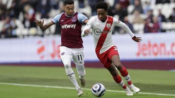 LONDON, ENGLAND - MAY 23: Jesse Lingard of West Ham United battles for possession with Kyle Walker-Peters of Southampton  during the Premier League match between West Ham United and Southampton at London Stadium on May 23, 2021 in London, England. A limit