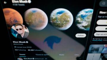 In this photo illustration Twitter logo seen displayed on a smartphone screen with Elon Musk Twitter in the background in Chania, Crete Island, Greece on April 23, 2022. (Photo illustration by Nikolas Kokovlis/NurPhoto via Getty Images)