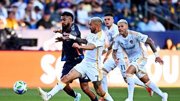 Feb 23, 2025; Carson, California, USA; LA Galaxy midfielder Diego Fagundez (7) and San Diego FC defender Franco Negri (22) go for the ball during the second half at Dignity Health Sports Park. Mandatory Credit: Jonathan Hui-Imagn Images