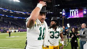 MINNEAPOLIS, MINNESOTA - DECEMBER 31: Jordan Love #10 and Aaron Jones #33 of the Green Bay Packers celebrate after a 33-10 victory against the Minnesota Vikings at U.S. Bank Stadium on December 31, 2023 in Minneapolis, Minnesota.   David Berding/Getty Images/AFP (Photo by David Berding / GETTY IMAGES NORTH AMERICA / Getty Images via AFP)