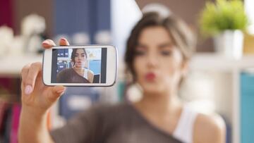 Beautiful woman taking selfie photo with blowing a kisses