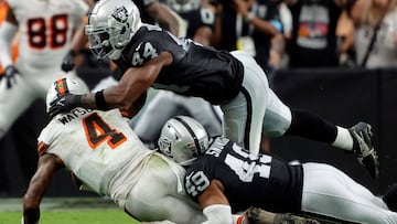 LAS VEGAS, NEVADA - SEPTEMBER 29: Deshaun Watson #4 of the Cleveland Browns runs with the ball while being tackled by K'Lavon Chaisson #44 and Charles Snowden #49 of the Las Vegas Raiders in the fourth quarter at Allegiant Stadium on September 29, 2024 in Las Vegas, Nevada. Steve Marcus/Getty Images/AFP (Photo by Steve Marcus / GETTY IMAGES NORTH AMERICA / Getty Images via AFP)