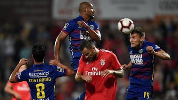 Benfica's Swiss forward Haris Seferovic (C) jumps for the ball with Chaves' Portuguese midfielder Stephen Eustaquio (L), Brazilian defender Marcao (TOP) and Serbian defender Nikola Maras during the Portuguese league footbal match between GD Chav