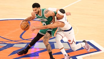 Josh Hart #3 of the New York Knicks attempts to steal the ball from Jayson Tatum #0 of the Boston Celtics during the fourth quarter at Madison Square Garden on April 09, 2026 in New York City.