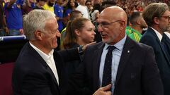 France's head coach Didier Deschamps (L) cheers Spain's head coach Luis de la Fuente ahead of the UEFA Euro 2024 semi-final football match between Spain and France at the Munich Football Arena in Munich on July 9, 2024. (Photo by FRANCK FIFE / AFP)