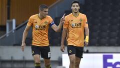 Wolverhampton Wanderers&#039; Raul Jimenez, right, talks with his captain Conor Coady after scoring his team&#039;s first goal from the penalty spot during the Europa League round of 16 second leg soccer match between Wolves and Olympiakos at Molineux Sta