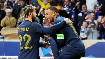 France's forward #10 Kylian Mbappe celebrates with teammates after scoring his team's third goal on a penalty during the friendly football match between France and Scotland at Pierre-Mauroy stadium, in Villeneuve-D'Ascq, northern France, on October 17, 2023. (Photo by FRANCOIS LO PRESTI / AFP)