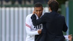 Paris Saint-Germain&#039;s Brazilian sporting director Leonardo embraces Paris Saint-Germain&#039;s French forward Kylian Mbappe prior to a training session at the Camp des Loges Paris Saint-Germain football club&#039;s training ground in Saint-Germain-en