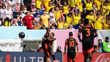 Colombia's forward #11 Jhon Arias (L) celebrates scoring his team's first goal during the international friendly football match between the USA and Colombia at Commanders Field in Greater Landover, Maryland, on June 8, 2024. (Photo by ROBERTO SCHMIDT / AFP)