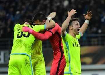 Gent's Brecht Dejaegere and teammates celebrate after beating Tottenham Hotspur.