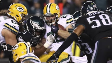 PHILADELPHIA, PA - NOVEMBER 28: Aaron Ripkowski #22 of the Green Bay Packers runs the ball and is tackled by Brandon Graham #55, Rodney McLeod #23 and Jordan Hicks #58 of the Philadelphia Eagles in the fourth quarter at Lincoln Financial Field on November 28, 2016 in Philadelphia, Pennsylvania. Elsa/Getty Images/AFP
== FOR NEWSPAPERS, INTERNET, TELCOS & TELEVISION USE ONLY ==