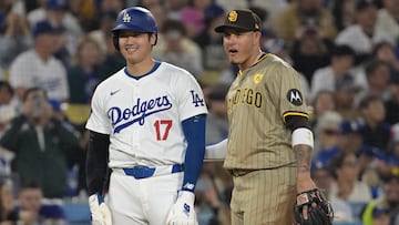 Sep 26, 2024; Los Angeles, California, USA; Los Angeles Dodgers designated hitter Shohei Ohtani (17) and San Diego Padres third baseman Manny Machado (13) talk on the base during the seventh inning at Dodger Stadium. Mandatory Credit: Jayne Kamin-Oncea-Imagn Images