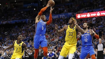 Mar 27, 2019; Oklahoma City, OK, USA; Oklahoma City Thunder guard Russell Westbrook (0) passes the ball to Oklahoma City Thunder center Steven Adams (12) between Indiana Pacers guard Darren Collison (2) and Indiana Pacers center Myles Turner (33) during the second half at Chesapeake Energy Arena. Oklahoma City won 107-99. Mandatory Credit: Alonzo Adams-USA TODAY Sports