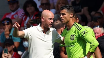 (FILES) In this file photo taken on August 27, 2022 Manchester United's Dutch manager Erik ten Hag (L) directs substitute Manchester United's Portuguese striker Cristiano Ronaldo during the English Premier League football match between Southampton and Manchester United at St Mary's Stadium in Southampton, southern England. - Manchester United said on November 18, 2022 the club have "initiated appropriate steps" following an explosive interview by Cristiano Ronaldo that left his future at Old Trafford in doubt. The five-time Ballon d'Or winner said he did not respect United manager Erik ten Hag and took aim at the club's owners, the Glazer family, during the 90-minute interview aired on TalkTV. (Photo by Adrian DENNIS / AFP) / RESTRICTED TO EDITORIAL USE. No use with unauthorized audio, video, data, fixture lists, club/league logos or 'live' services. Online in-match use limited to 120 images. An additional 40 images may be used in extra time. No video emulation. Social media in-match use limited to 120 images. An additional 40 images may be used in extra time. No use in betting publications, games or single club/league/player publications. / 