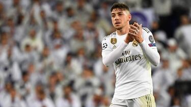 Real Madrid's Uruguayan midfielder Federico Valverde applauds during the UEFA Champions League group A football match Real Madrid against Paris Saint-Germain FC at the Santiago Bernabeu stadium in Madrid on November 26, 2019. (Photo by GABRIEL BOUYS / AFP
