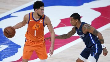 Aug 13, 2020; Lake Buena Vista, Florida, USA; Phoenix Suns' Devin Booker (1) dribbles as Dallas Mavericks' Trey Burke (right) defends during the second half of an NBA basketball game at ESPN Wide World of Sports Complex. Mandatory Credit: Ashley Landis/Pool Photo-USA TODAY Sports