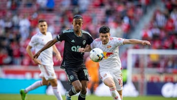 HARRISON, NJ - OCTOBER 09: Lewis Morgan #10 of New York Red Bulls battles for the ball against Kerwin Vargas #18 of Charlotte FC in the first half of the Decision Day Major League Soccer match at Red Bull Arena on October 9, 2022 in Harrison, New Jersey. (Photo by Ira L. Black - Corbis/Getty Images)